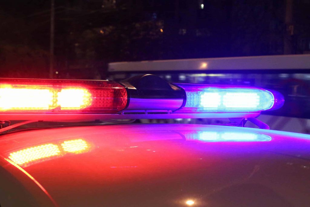 Close-up of the red and blue lights on top of a police car.