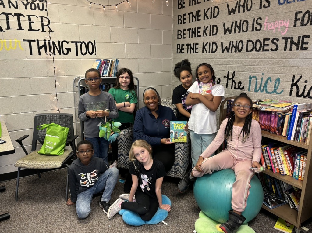 State Representative and City Council candidate, Helena Scott, reading to school children